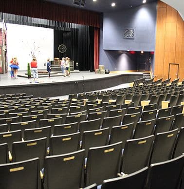 Lassen auditorium, 500 seat theater with black chairs