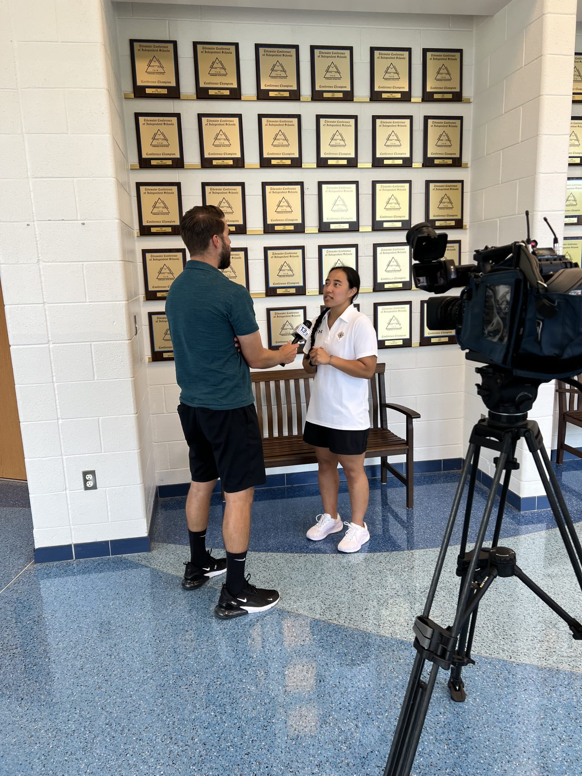 Head Varsity Field Hockey Coach getting interviewed behind the scenes