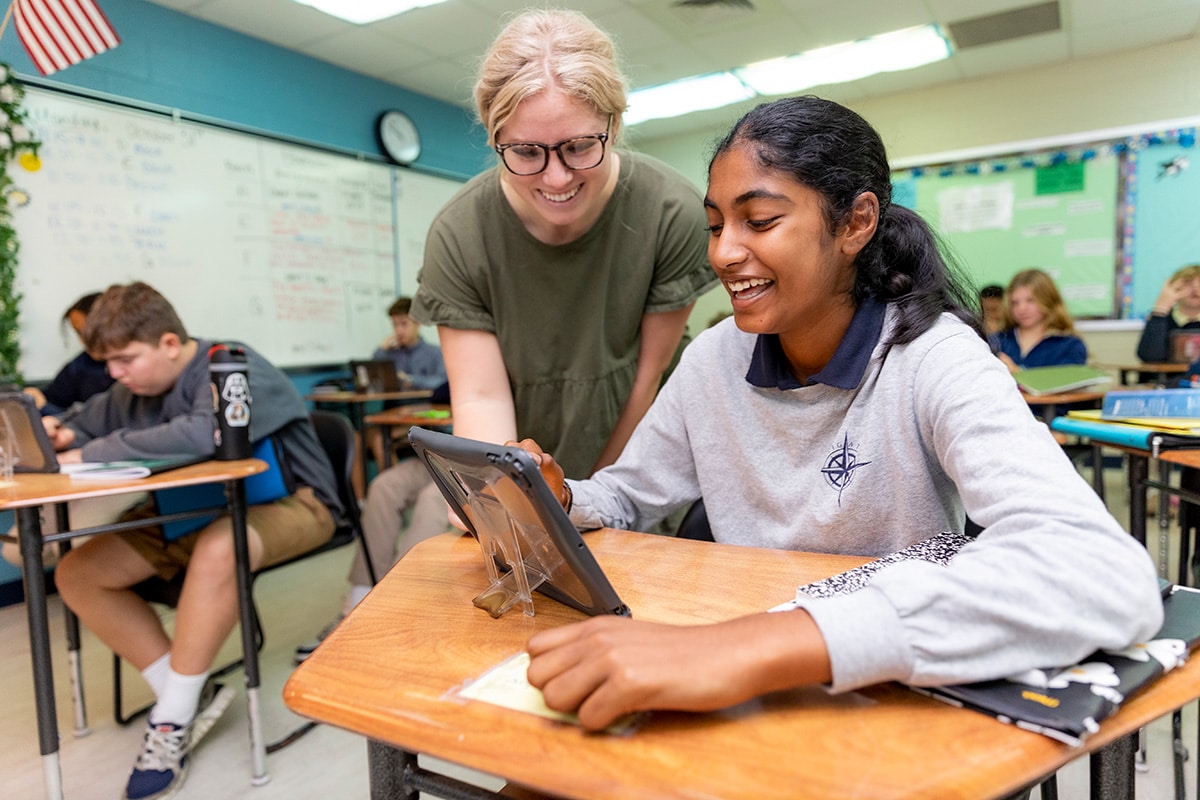 teacher and student laughing