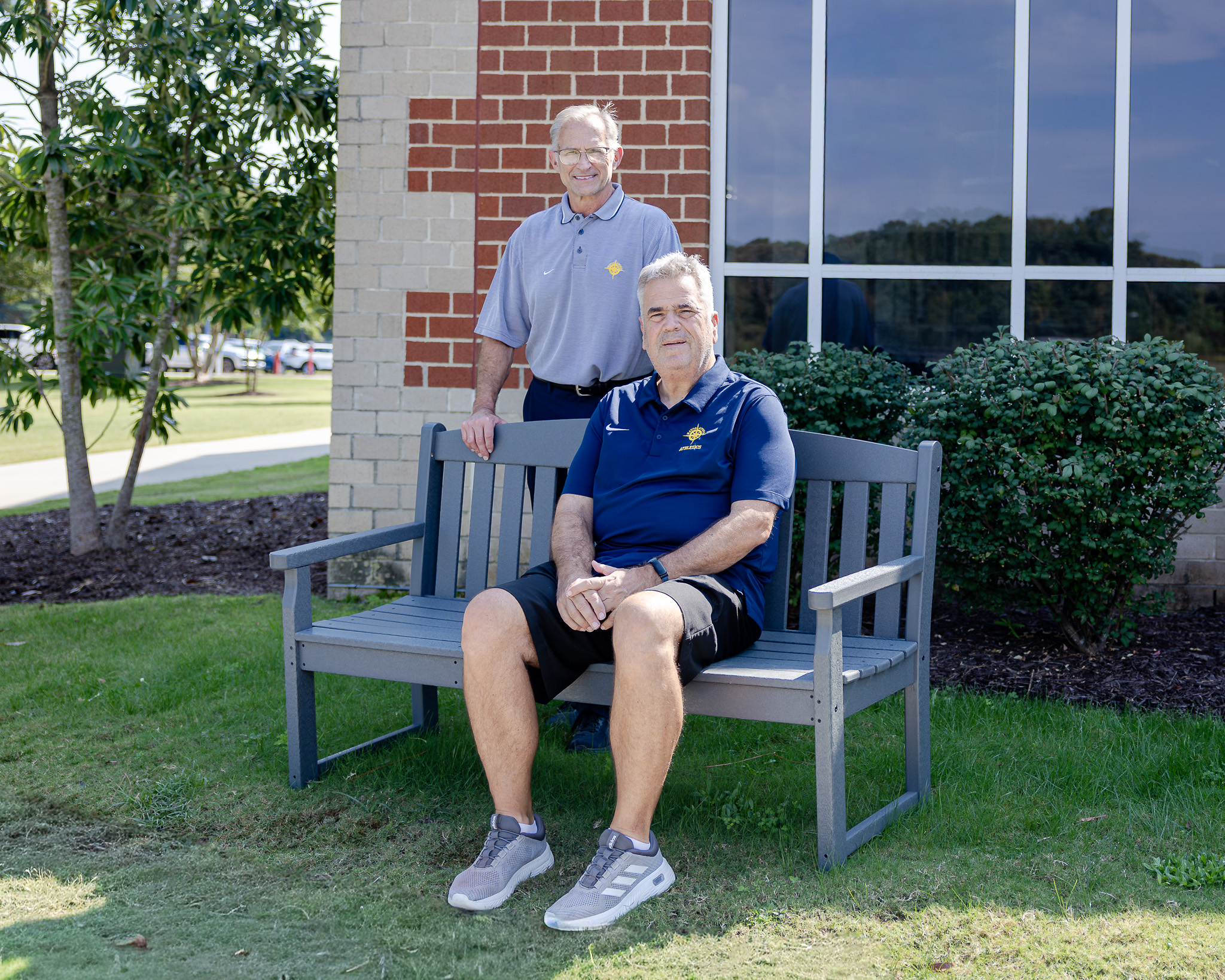 Tommy Yevak '83 and Coach David Legg '80 with HRA Class of 1980 memorial bench