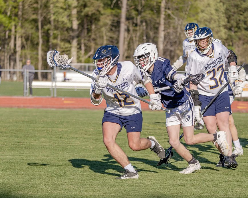 HRA boys lacrosse players on the field in spring 2025