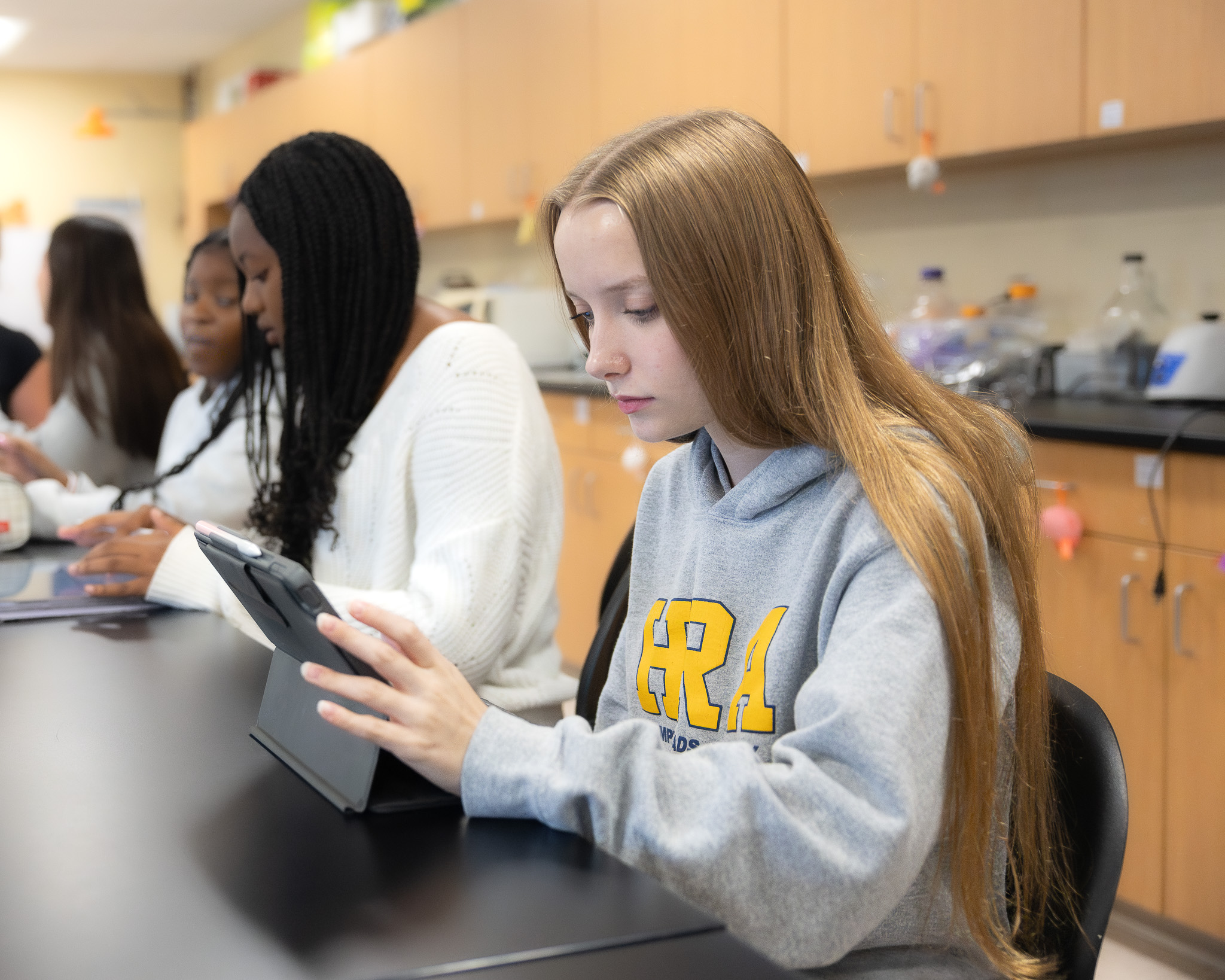 An HRA Upper School student uses her iPad