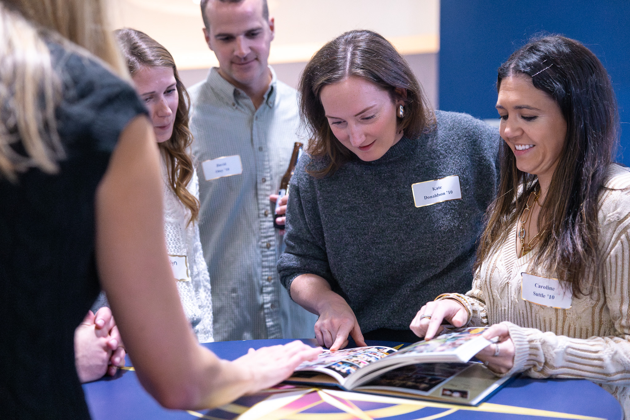 HRA alumni read an old yearbook