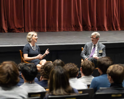 Delegate Amanda Batten speaks with Upper School government teacher Christopher Hailey during HRA's 2025 Election Symposium