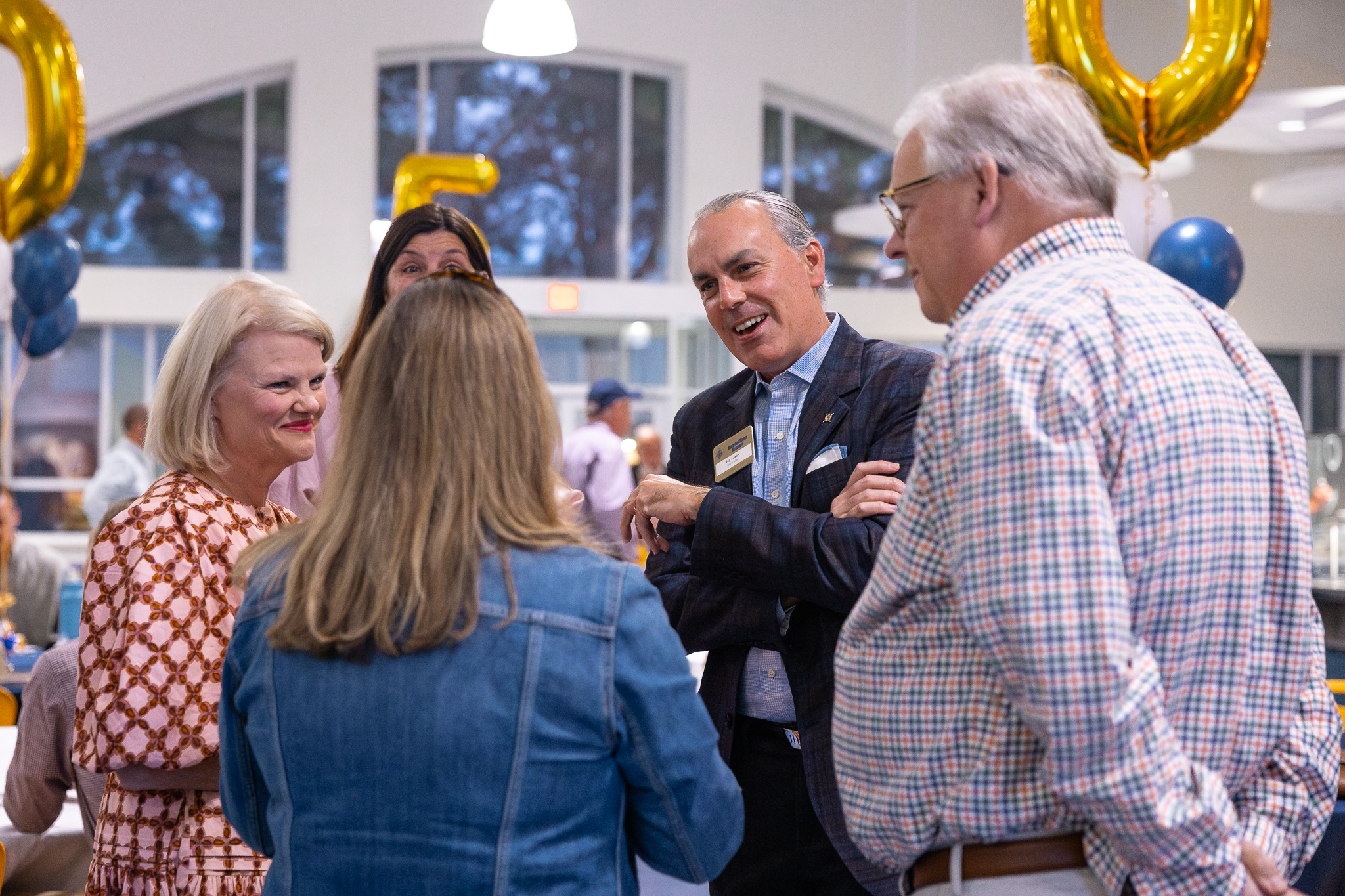 HRA Head of School Jay Lasley with alumni at the 2025 on-campus reunion party