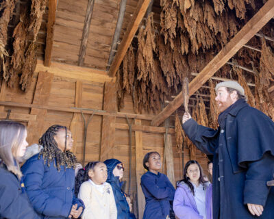 HRA fourth graders in a tobacco barn at the American Revolution Museum at Yorktown