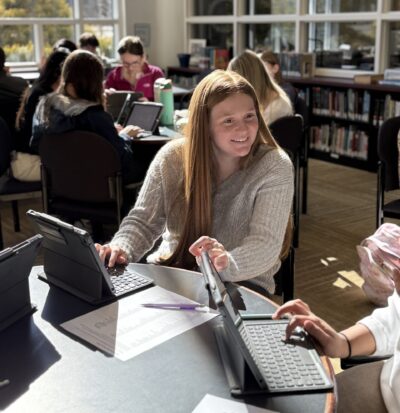 HRA students completing a college counseling survey