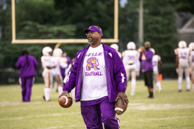 Incoming HRA varsity football Head Coach Rodney Taylor on the field at Menchville High School
