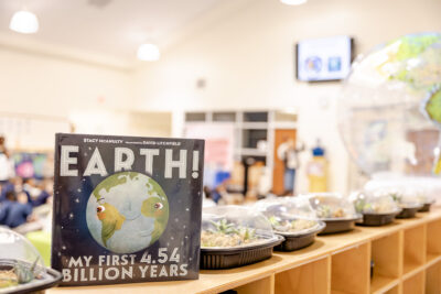 Earth! by Stacy McAnulty, displayed with HRA Lower Schoolers' projects