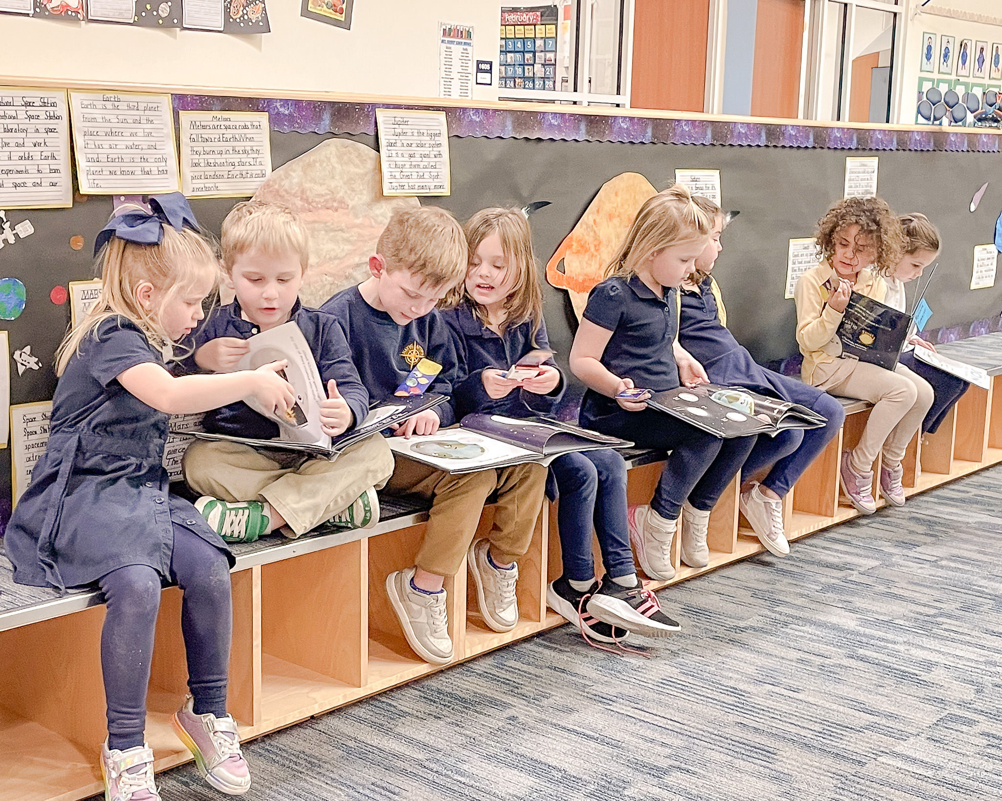 HRA Lower School students with books by Stacy McAnulty