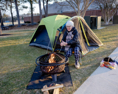HRA Director of Lower School Susanne Swain '78 at her campsite, rewarding students for their successful completion of the 2026 Reading Challenge