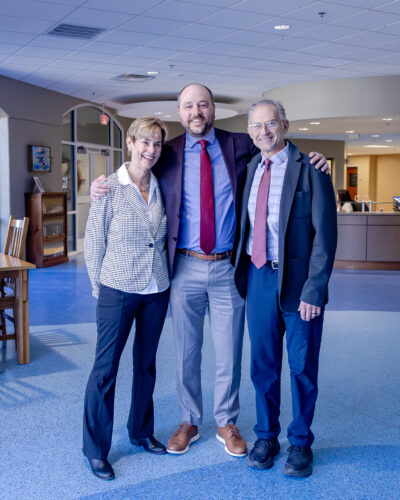 Interim Director of Middle School Karen Gillespie, alumnus David Schmidt '05, and Director of Alumni Relations Tommy Yevak '83 at HRA