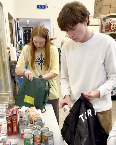 HRA Philanthropy Committee members volunteering at THRIVE Peninsula food pantry