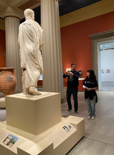 HRA English Department Chair Scott George discussing a statue with a student at the VMFA