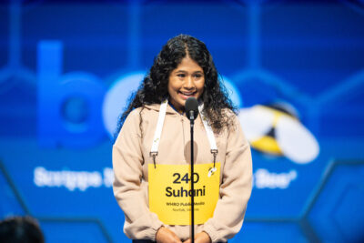 HRA eighth grader Suhani Joshi '30 on stage at the 2026 Scripps National Spelling Bee