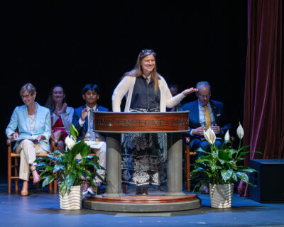HRA Middle School math teacher Jemma Kennedy speaking at the 2026 Eighth-Grade Crossing Ceremony