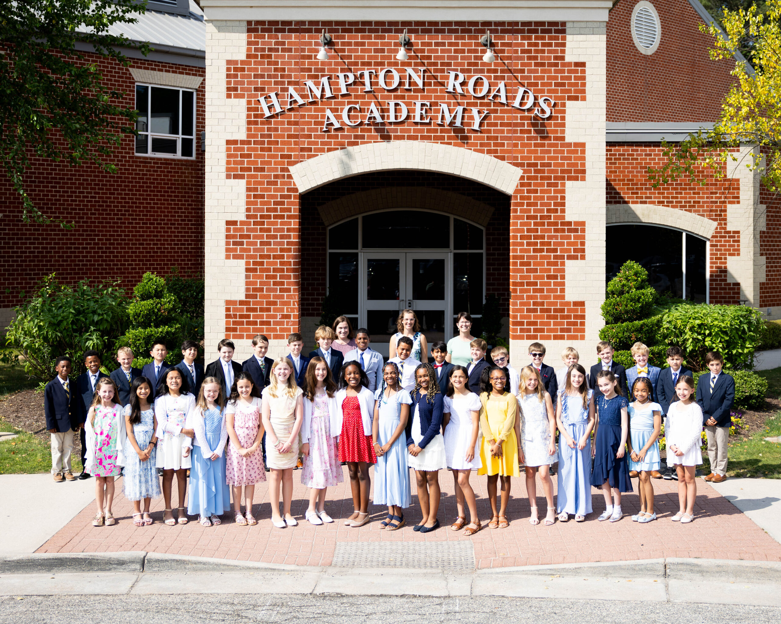 The fourth graders of the Class of 2034 in front of Hampton Roads Academy
