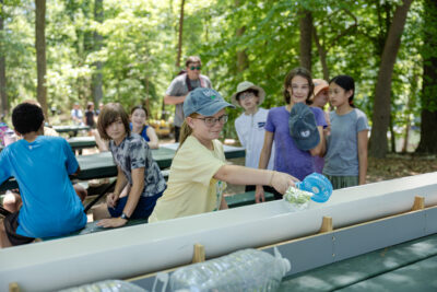 HRA seventh graders test model sailboats during their May 2026 field trip to Mariners' Lake