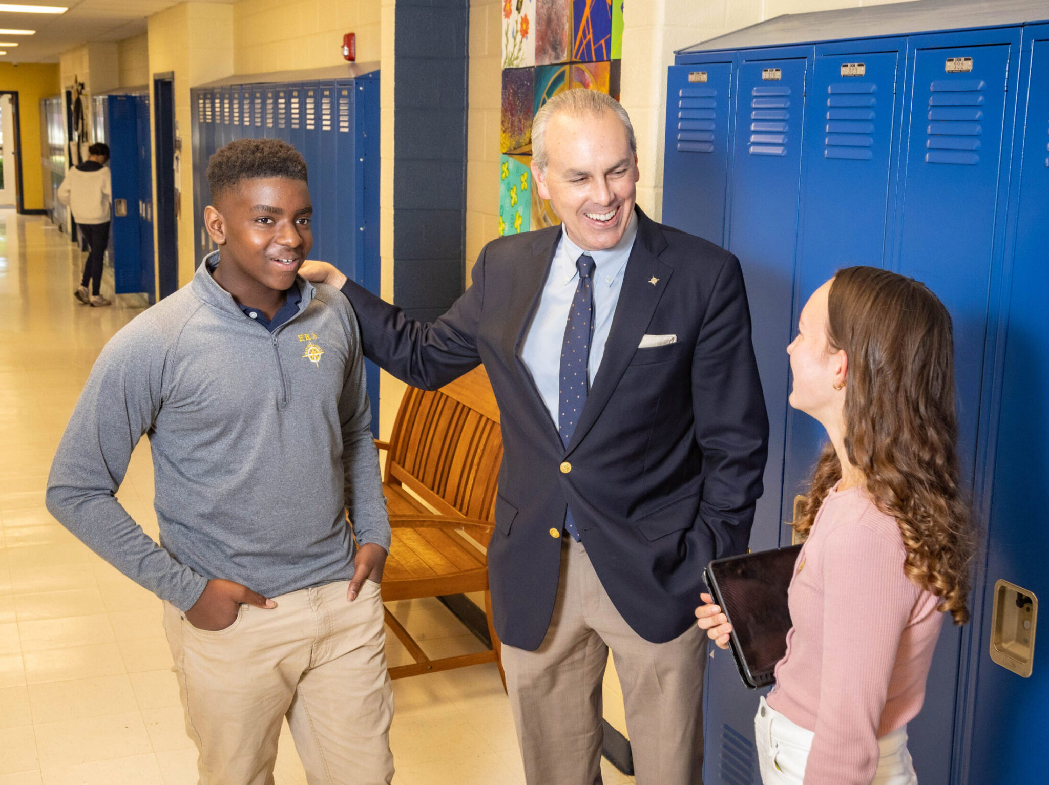 HRA Head of School Jay Lasley with two students