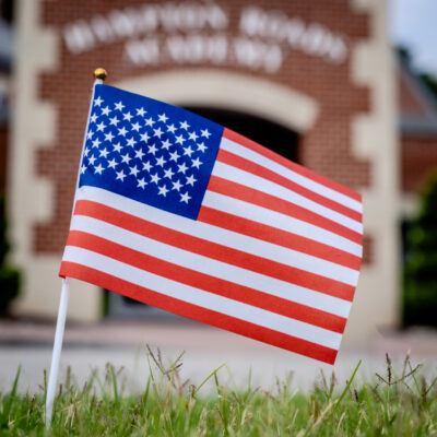 American flag in front of Hampton Roads Academy