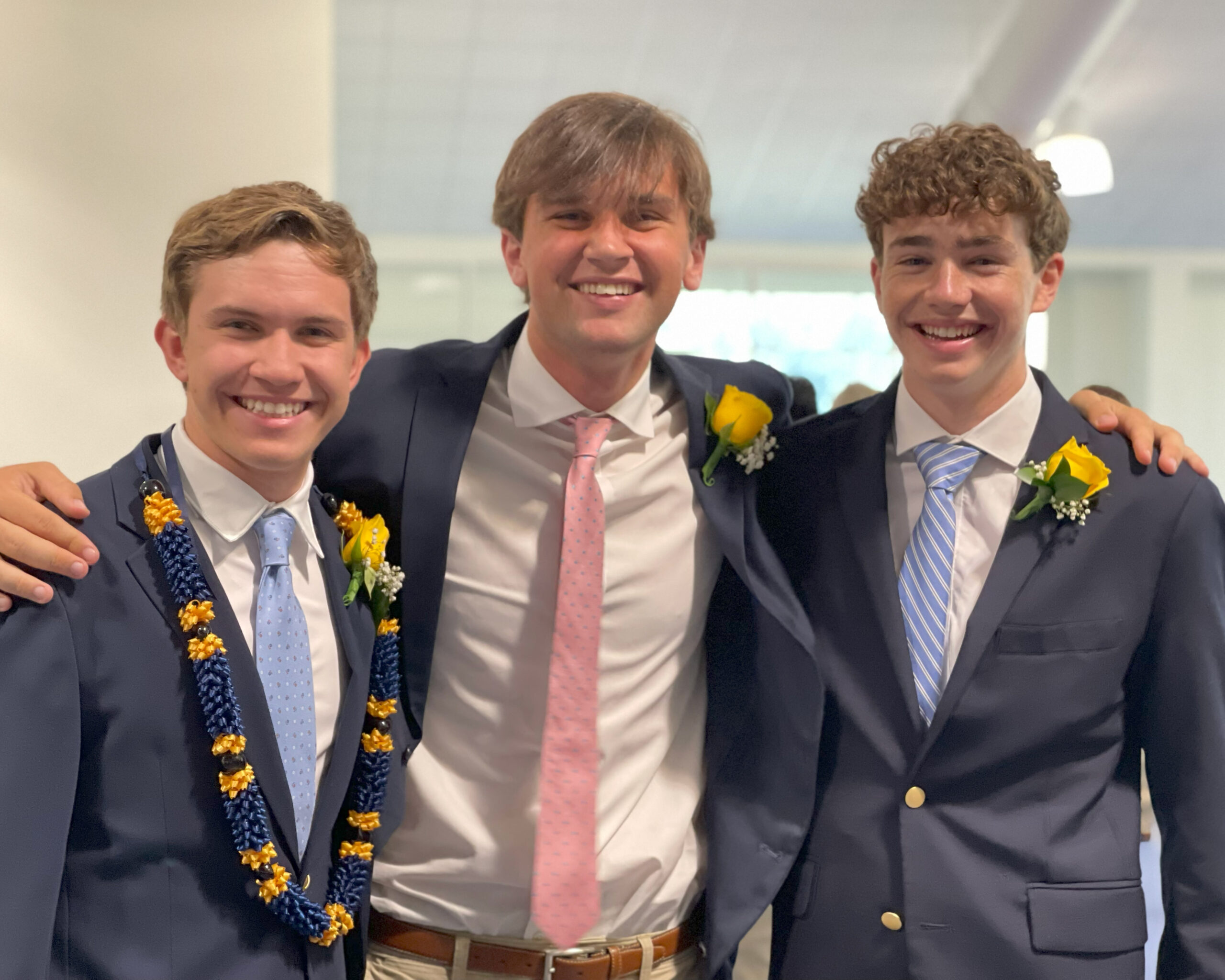 Members of the HRA Class of 2026 Nicholas Bielewicz, Henry Stern, and Jamie Dornan at graduation
