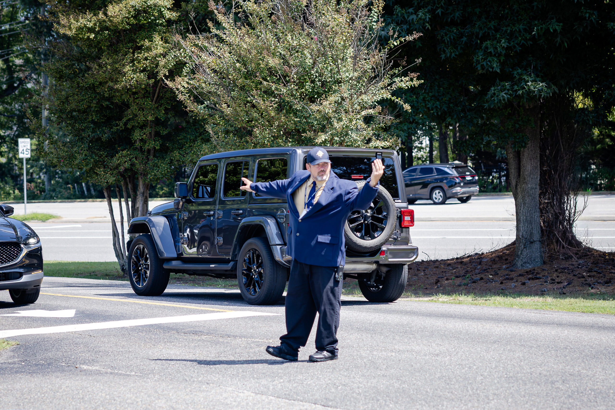 Col. Z_Security HRA security officer Col. Joshua Zoblisien directing the afternoon car line