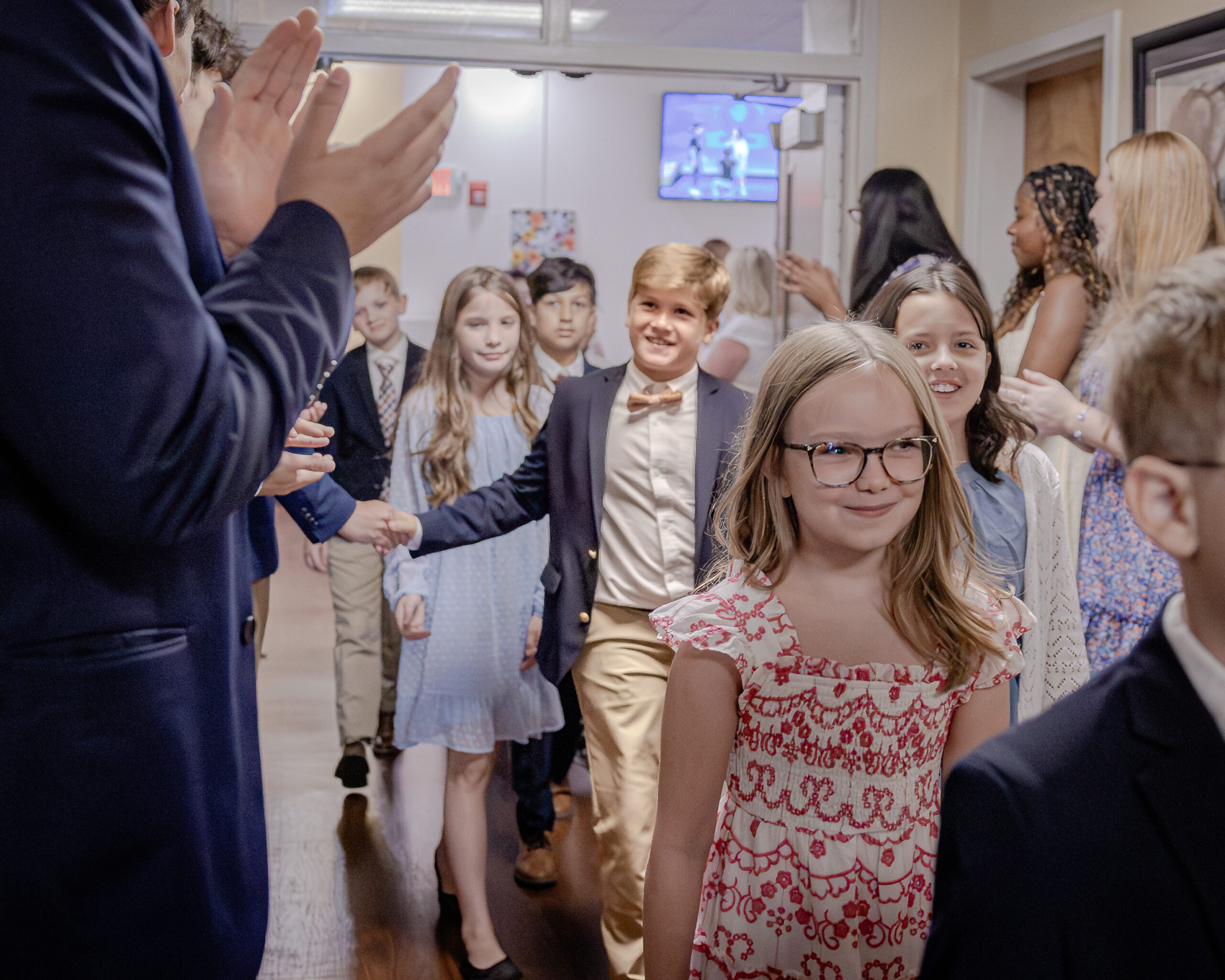 HRA seniors greeting fifth graders in the hallway following Convocation 2026, the official start of the Year of Resilience