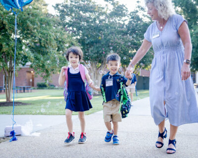 HRA Lower School students with Director of Ancillary Programs Shirley Tanguy on the first day of school, 2026