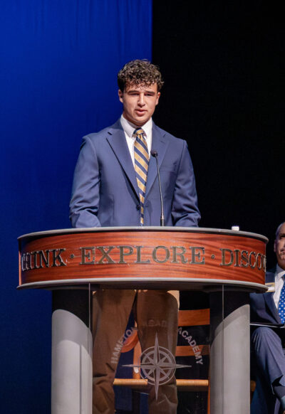 HRA Student Council Association President Luke Sablan '27 speaking at Convocation 2026