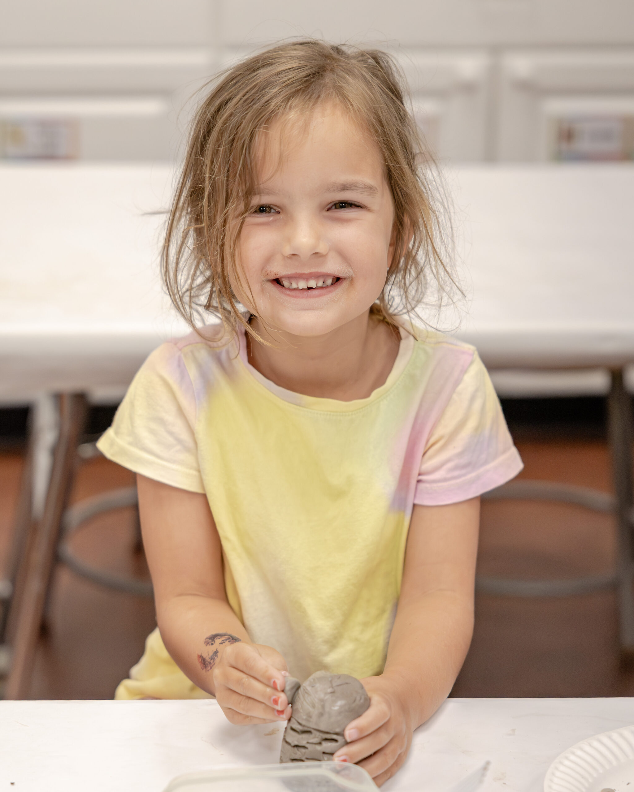 HRA camper sculpting clay in summer 2026