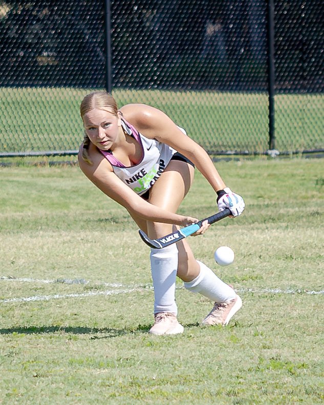 A student hitting a ball during HRA's summer 2026 Nike field hockey camp