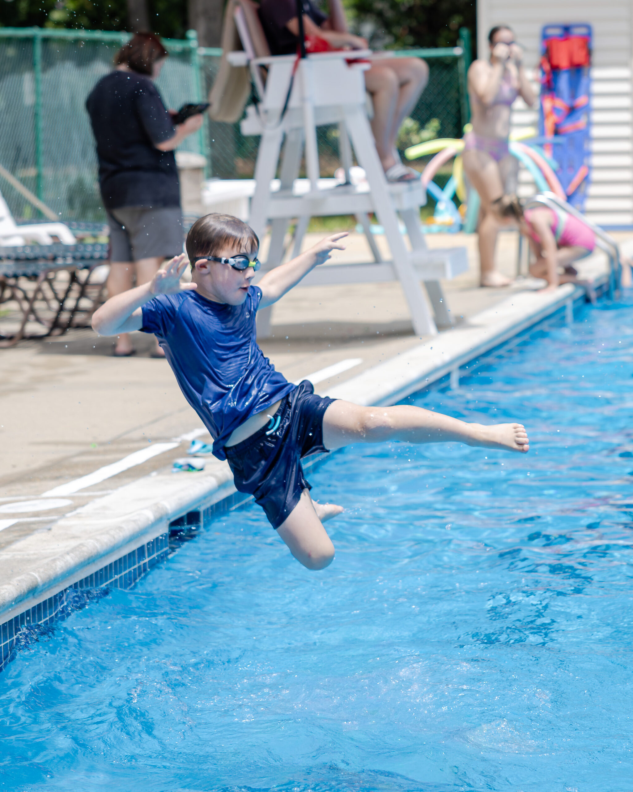 HRA camper jumping into the pool in summer 2026