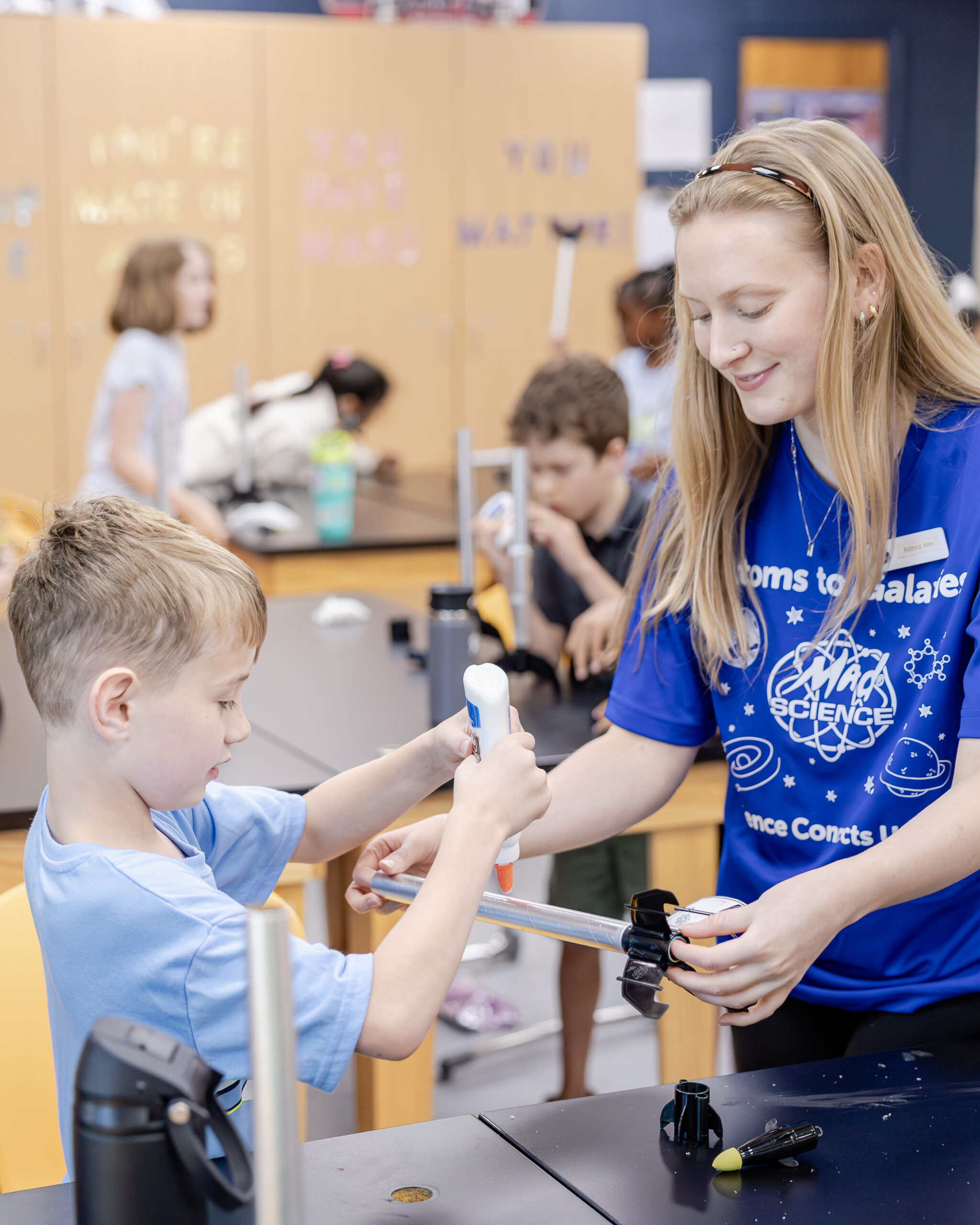 HRA camper building a model rocket as part of a craft and STEM program during summer 2026