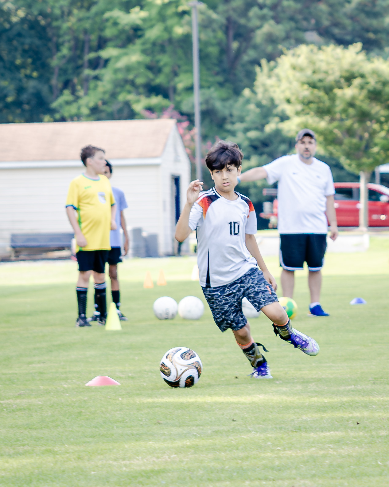 HRA camper playing soccer in summer 2026