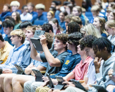 HRA students using their iPads for an interactive activity during an assembly in the Svein J. Lassen Auditorium