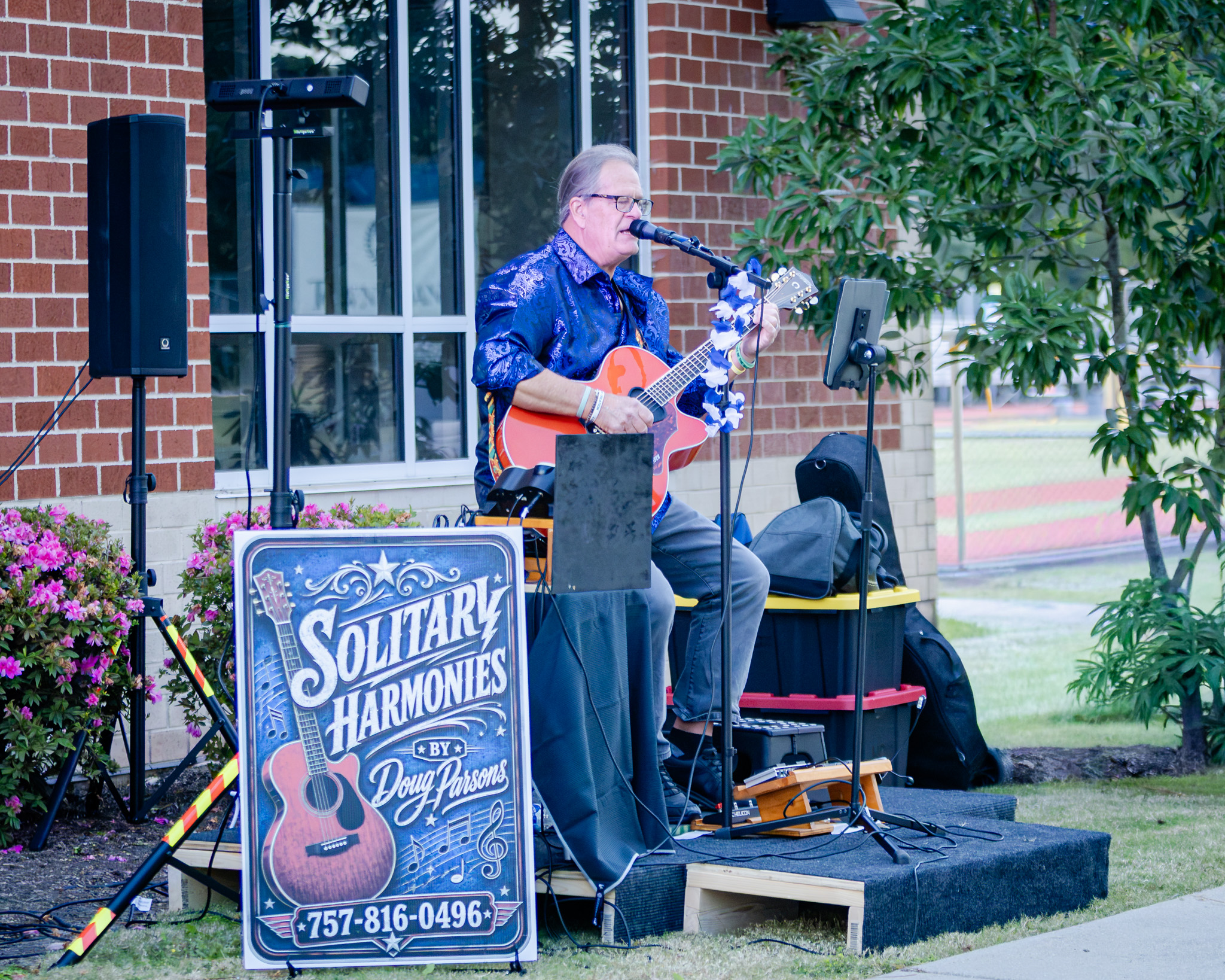 HRA alumnus and honorary All-Alumni Tailgate host Doug Parsons '81 performing at Homecoming 2026