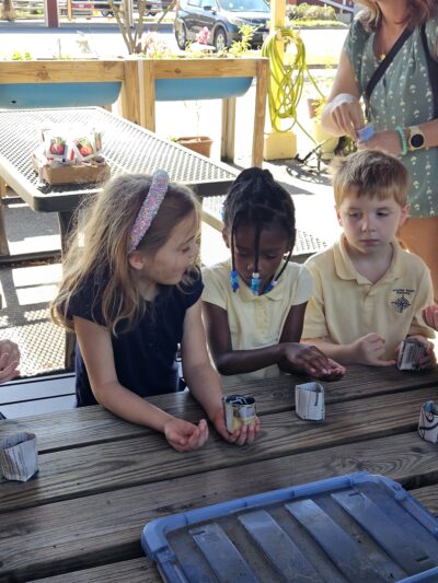 HRA first graders planting seeds at the Virginia Beach Farmers Market
