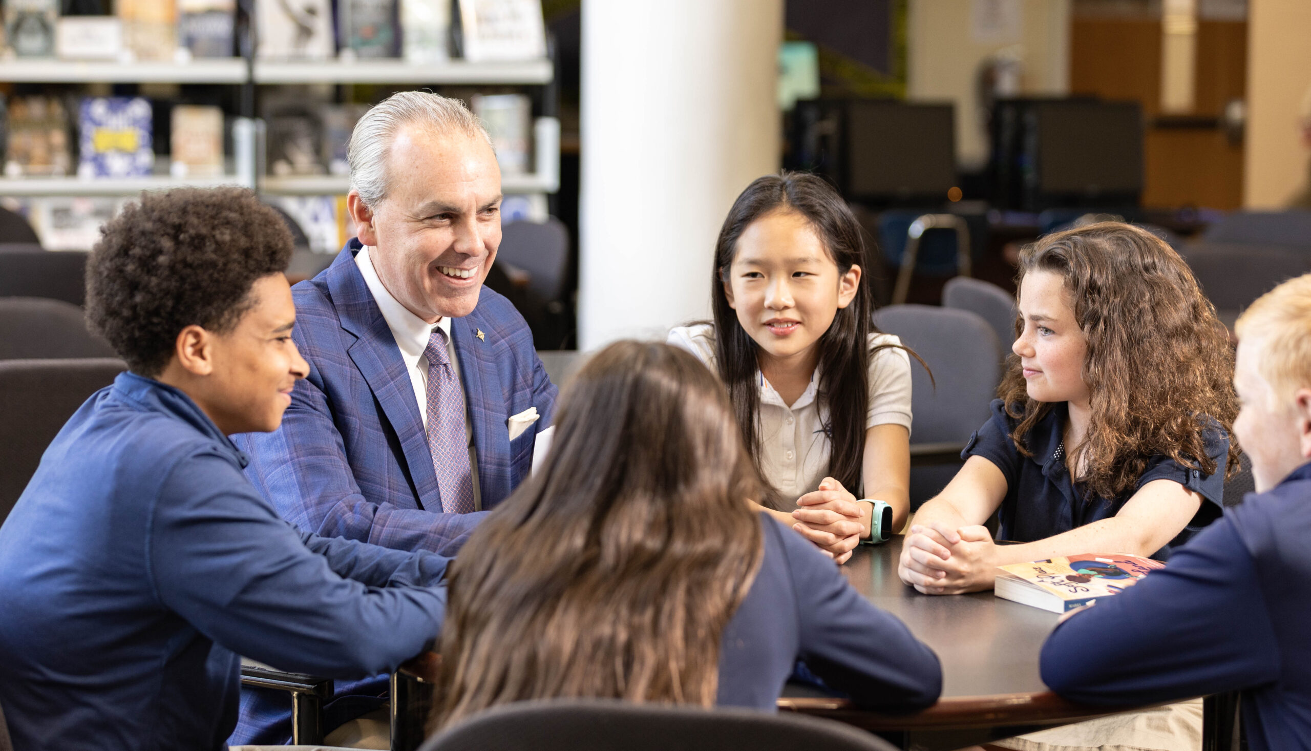 HRA Head of School Jay Lasley engaged in conversation with a group of Middle Scholl students in the Ferguson Media Center