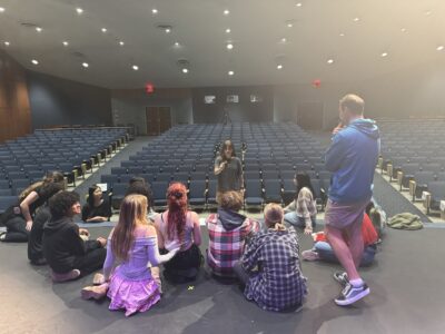 Hannah Mead '25 directing the original cast of her play Echoes of Courage at HRA in May 2025
