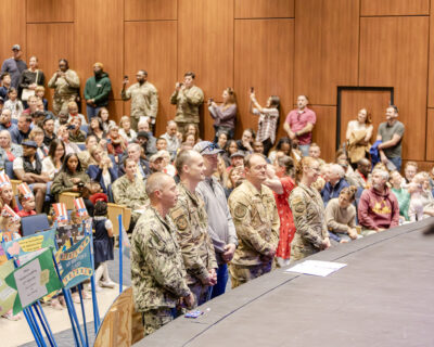 HRA parents in the military stand in uniform during the Lower School's 2025 "Salute to the Military"